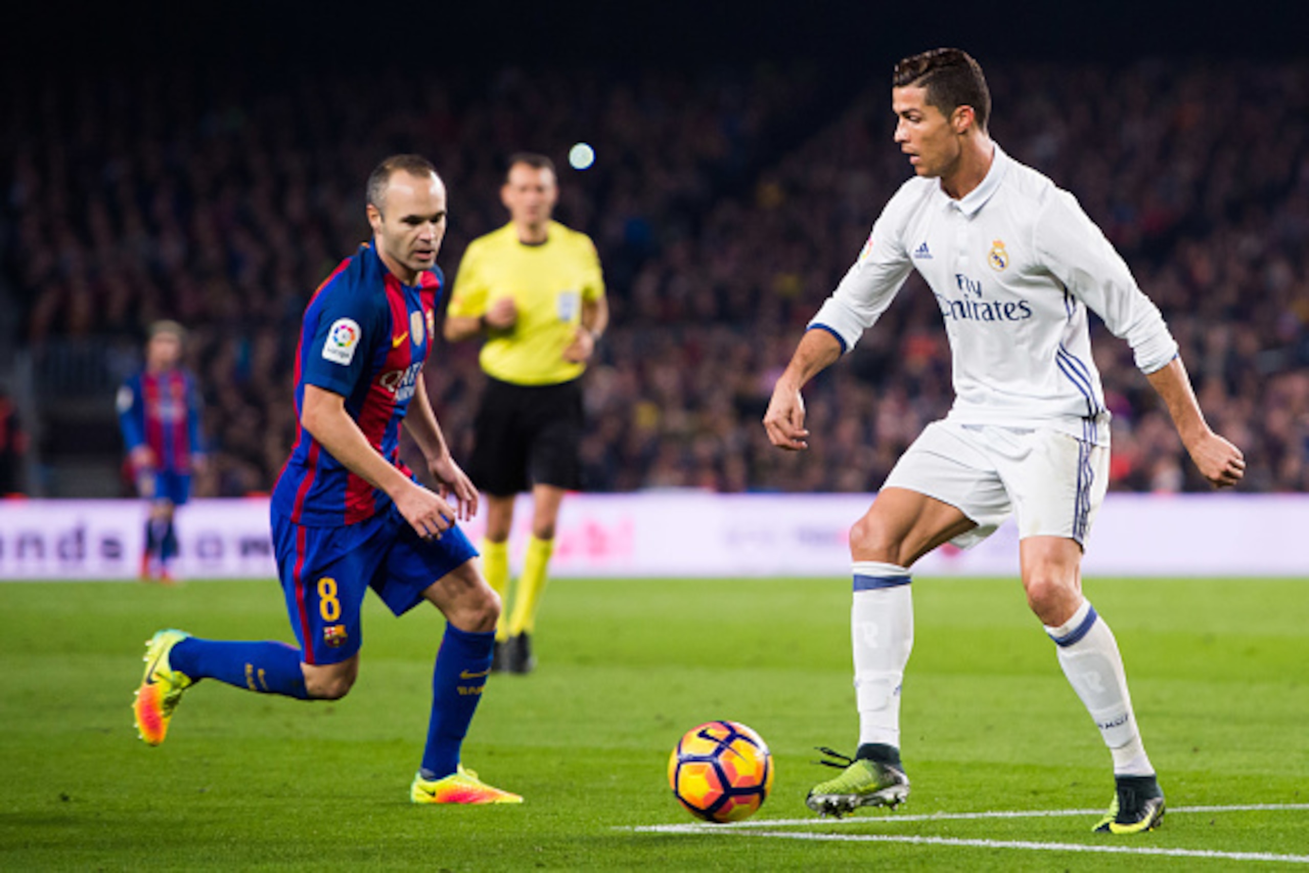 BARCELONA, SPAIN - DECEMBER 03: Cristiano Ronaldo (R) of Real Madrid CF controls the ball next to Andres Iniesta (L) of FC Barcelona during the La Liga match between FC Barcelona and Real Madrid CF at Camp Nou stadium on December 3, 2016 in Barcelona, Spa BARCELONA, SPAIN - DECEMBER 03: Cristiano Ronaldo (R) of Real Madrid CF controls the ball next to Andres Iniesta (L) of FC Barcelona during the La Liga match between FC Barcelona and Real Madrid CF at Camp Nou stadium on December 3, 2016 in Barcelona, Spa