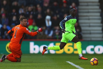 BOURNEMOUTH, ENGLAND - DECEMBER 04:  Sadio Mane of Liverpool beats Artur Boruc of AFC Bournemouth to score their first goal during the Premier League match between AFC Bournemouth and Liverpool at Vitality Stadium on December 4, 2016 in Bournemouth, Engla