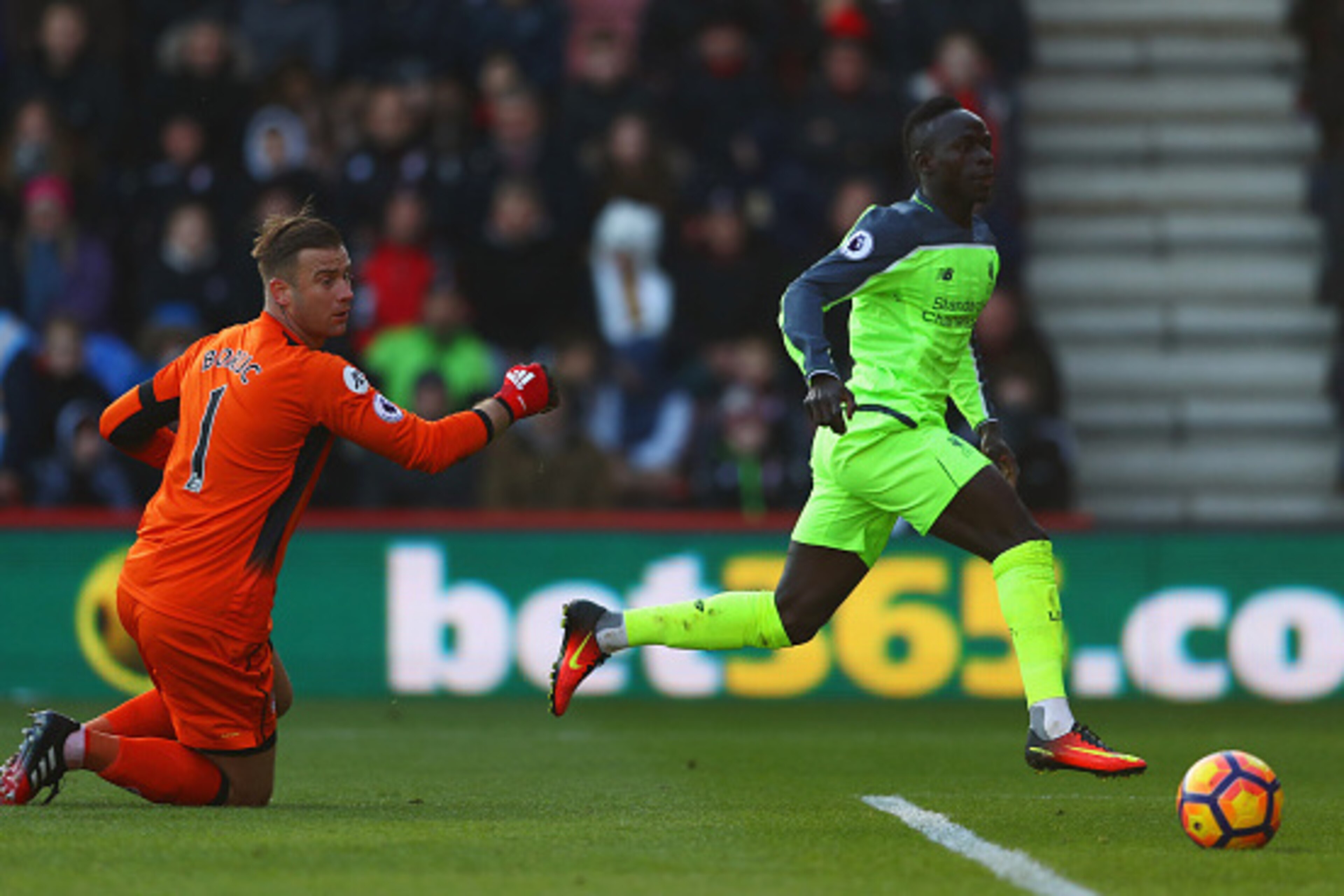BOURNEMOUTH, ENGLAND - DECEMBER 04:  Sadio Mane of Liverpool beats Artur Boruc of AFC Bournemouth to score their first goal during the Premier League match between AFC Bournemouth and Liverpool at Vitality Stadium on December 4, 2016 in Bournemouth, Engla