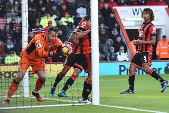 Bournemouth's Polish goalkeeper Artur Boruc (L) claims the ball on the goal-line very close to conceding a goal during the English Premier League football match between Bournemouth and Liverpool at the Vitality Stadium in Bournemouth, southern England on 
