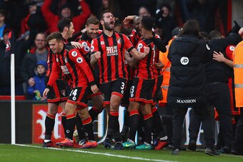 BOURNEMOUTH, ENGLAND - DECEMBER 04:  Steve Cook of AFC Bournemouth (3) celebrates with team mates as Nathan Ake of AFC Bournemouth scores their fourth goal during the Premier League match between AFC Bournemouth and Liverpool at Vitality Stadium on Decemb