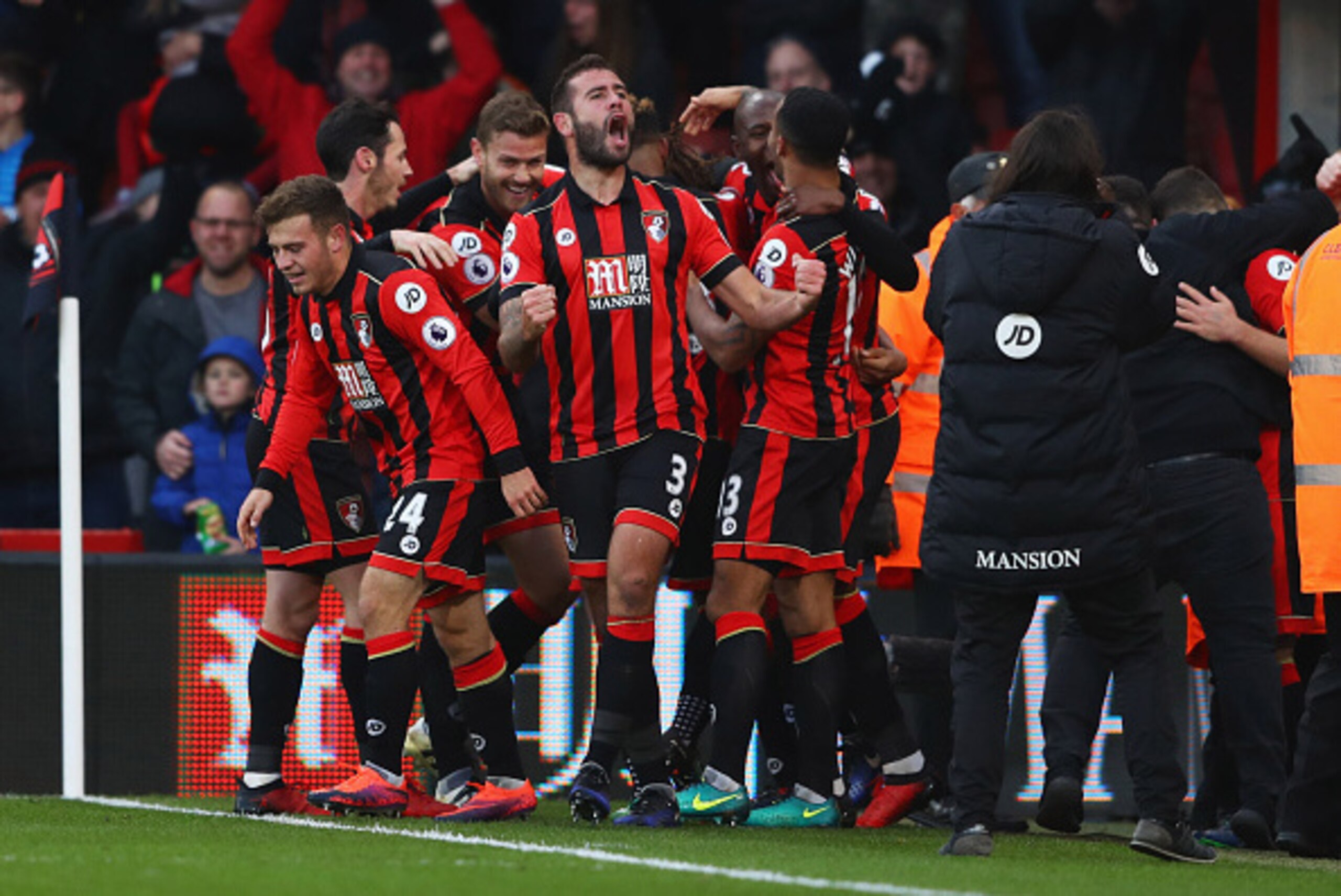 BOURNEMOUTH, ENGLAND - DECEMBER 04: Steve Cook of AFC Bournemouth (3) celebrates with team mates as Nathan Ake of AFC Bournemouth scores their fourth goal during the Premier League match between AFC Bournemouth and Liverpool at Vitality Stadium on Decemb BOURNEMOUTH, ENGLAND - DECEMBER 04: Steve Cook of AFC Bournemouth (3) celebrates with team mates as Nathan Ake of AFC Bournemouth scores their fourth goal during the Premier League match between AFC Bournemouth and Liverpool at Vitality Stadium on Decemb