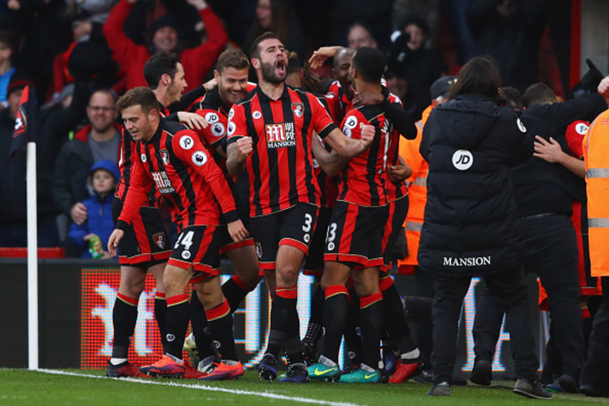 BOURNEMOUTH, ENGLAND - DECEMBER 04: Steve Cook of AFC Bournemouth (3) celebrates with team mates as Nathan Ake of AFC Bournemouth scores their fourth goal during the Premier League match between AFC Bournemouth and Liverpool at Vitality Stadium on Decemb BOURNEMOUTH, ENGLAND - DECEMBER 04: Steve Cook of AFC Bournemouth (3) celebrates with team mates as Nathan Ake of AFC Bournemouth scores their fourth goal during the Premier League match between AFC Bournemouth and Liverpool at Vitality Stadium on Decemb