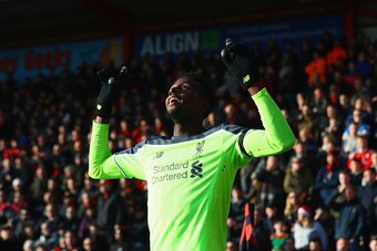 BOURNEMOUTH, ENGLAND - DECEMBER 04:  Divock Origi of Liverpool celebrates as he scores their second goal during the Premier League match between AFC Bournemouth and Liverpool at Vitality Stadium on December 4, 2016 in Bournemouth, England.  (Photo by Mich