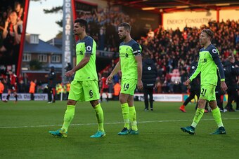 BOURNEMOUTH, ENGLAND - DECEMBER 04: A dejected looking Dejan Lovren, Jordan Henderson and Lucas Leiva of Liverpool trudge off at the end of the Premier League match between AFC Bournemouth and Liverpool at Vitality Stadium on December 4, 2016 in Bournemou