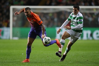 GLASGOW, SCOTLAND - SEPTEMBER 28: Aleksandar Kolarov of Manchester City and Tom Rogic of Celtic during the UEFA Champions League match between Celtic and Manchester City at Celtic Park on September 28, 2016 in Glasgow, Scotland. (Photo by Matthew Ashton -