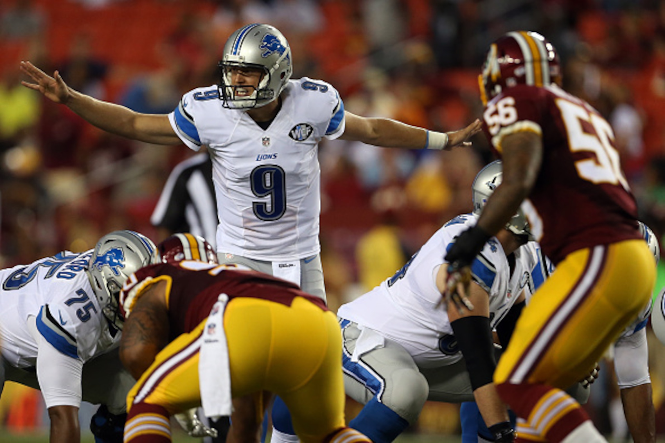LANDOVER, MD - AUGUST 20: Quarterback Matthew Stafford #9 of the Detroit Lions looks on at the line of scrimmage during a preseason game against the Washington Redskins at FedEx Field on August 20, 2015 in Landover, Maryland.  (Photo by Matt Hazlett/Getty
