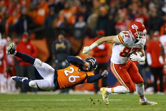 DENVER, CO - NOVEMBER 27:  Tight end Travis Kelce #87 of the Kansas City Chiefs shakes off free safety Darian Stewart #26 of the Denver Broncos after catching a pass in overtime at Sports Authority Field at Mile High on November 27, 2016 in Denver, Colora
