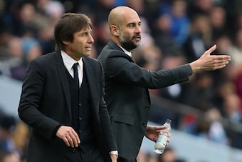 MANCHESTER, ENGLAND - DECEMBER 03: Antonio Conte manager / head coach of Chelsea and Josep Guardiola the head coach / manager of Manchester City during the Premier League match between Manchester City and Chelsea at Etihad Stadium on December 3, 2016 in M