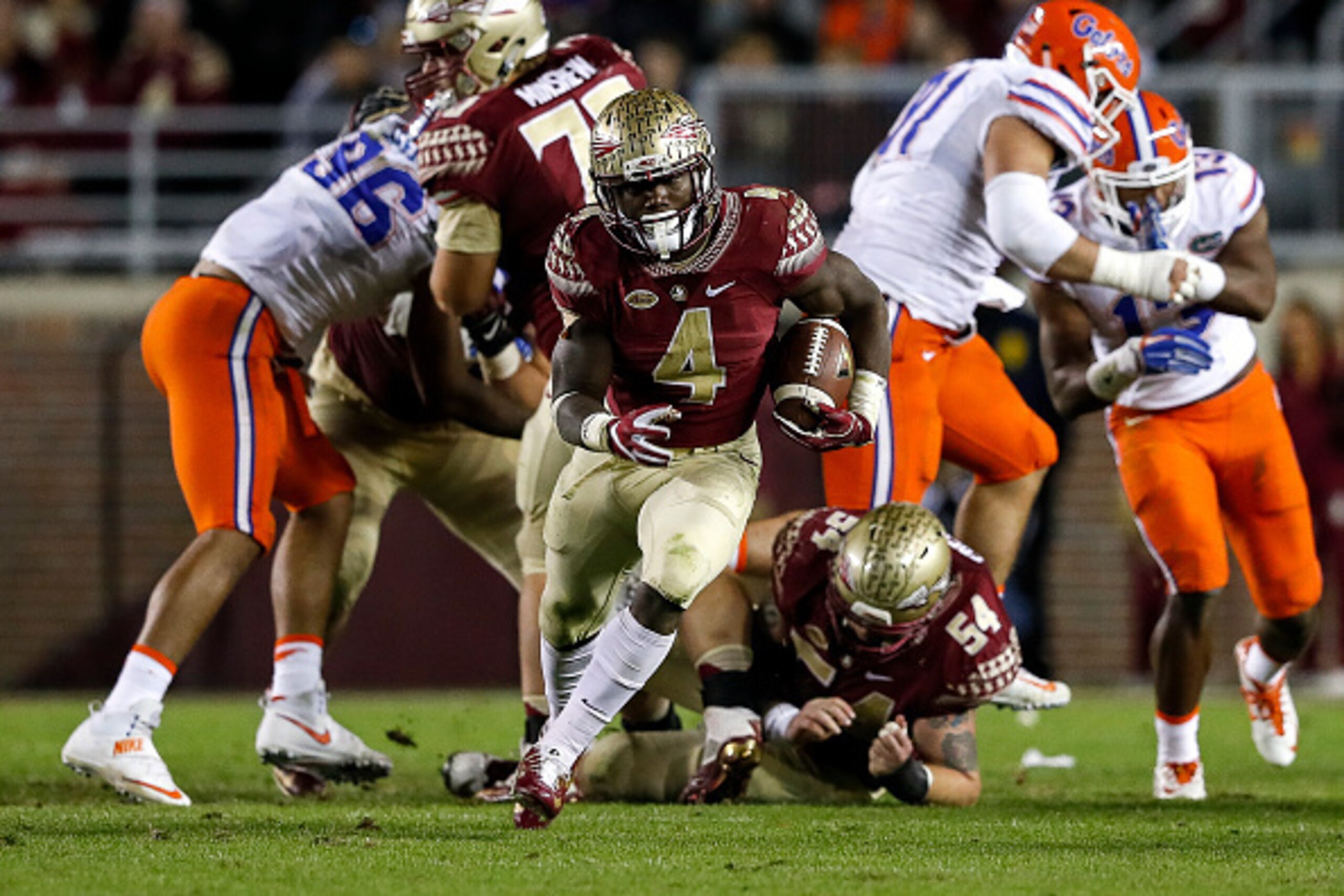 TALLAHASSEE, FL - NOVEMBER 26: Runningback Dalvin Cook #4 of the Florida State Seminoles breaks free up the middle on a running play during the game against the Florida Gators at Doak Campbell Stadium on Bobby Bowden Field on November 26, 2016 in Tallahas
