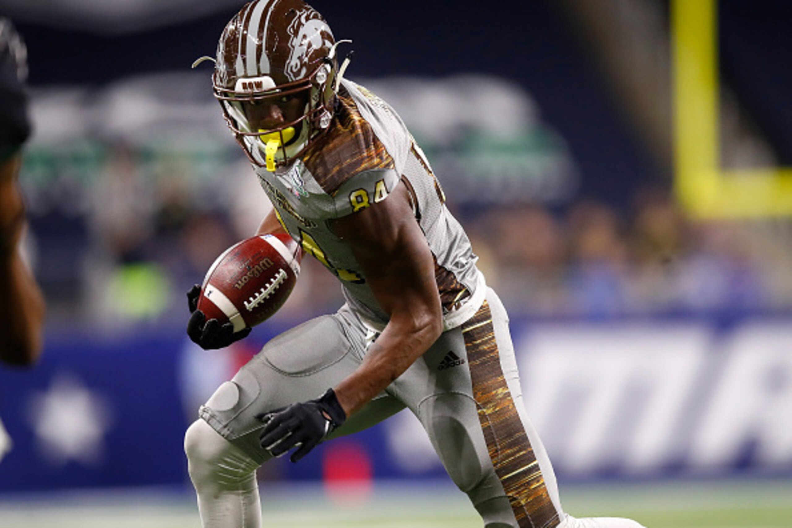 DETROIT, MI - DECEMBER 02: Corey Davis #84 of the Western Michigan Broncos looks for yards after a first half catch while playing the Ohio Bobcats during the MAC Championship on December 2, 2016 at Ford Field in Detroit, Michigan. (Photo by Gregory Shamus