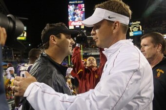 SEATTLE, WA - OCTOBER 13:  Head coach Lane Kiffin (R) of the USC Trojans is congratulated by head coach Steve Sarkisian of the Washington Huskies after the Trojans defeated the Huskies 24-14 on October 13, 2012 at CenturyLink Field in Seattle, Washington.