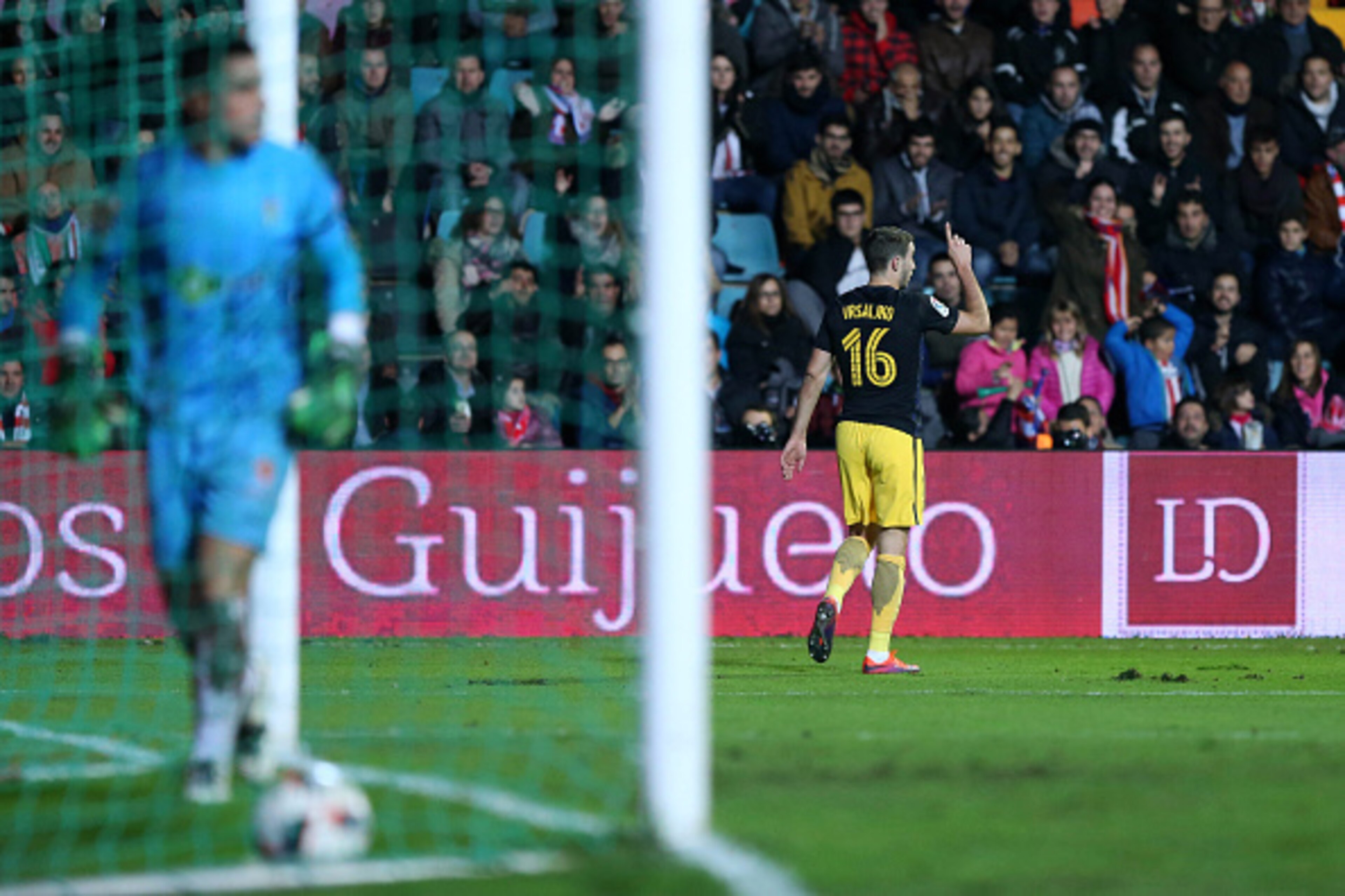 Atletico Madrid's Croatian defender Sime Vrsaljko (R) celebrates after scoring during the Spanish Copa del Rey (King's Cup) round of 32 first leg football match CD Guijuelo vs Club Atletico de Madrid at Helmantico stadium in Salamanca on November 30, 2016