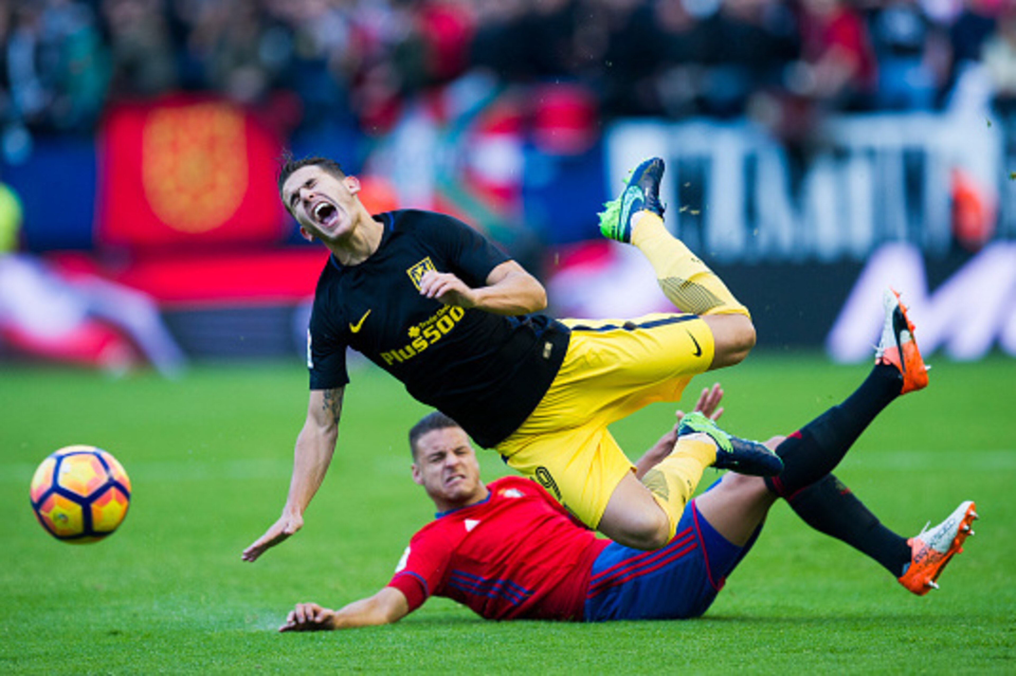 PAMPLONA, SPAIN - NOVEMBER 27:  Lucas Hernandez of Atletico Madrid duels for the ball with Cayetano Bonnin 'tano' of CA Osasuna during the La Liga match between CA Osasuna  and Atletico Madrid at Estadio Reyno de Navarra on November 27, 2016 in Pamplona, 