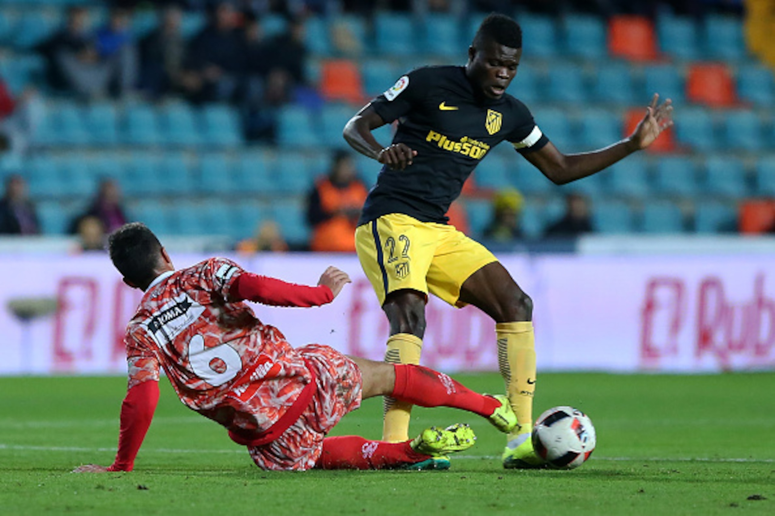 Guijuelo's midfielder Jorge Julia (L) vies with Atletico Madrid's Ghanaian midfielder Thomas Partey during the Spanish Copa del Rey (King's Cup) round of 32 first leg football match CD Guijuelo vs Club Atletico de Madrid at Helmantico stadium in Salamanca Guijuelo's midfielder Jorge Julia (L) vies with Atletico Madrid's Ghanaian midfielder Thomas Partey during the Spanish Copa del Rey (King's Cup) round of 32 first leg football match CD Guijuelo vs Club Atletico de Madrid at Helmantico stadium in Salamanca