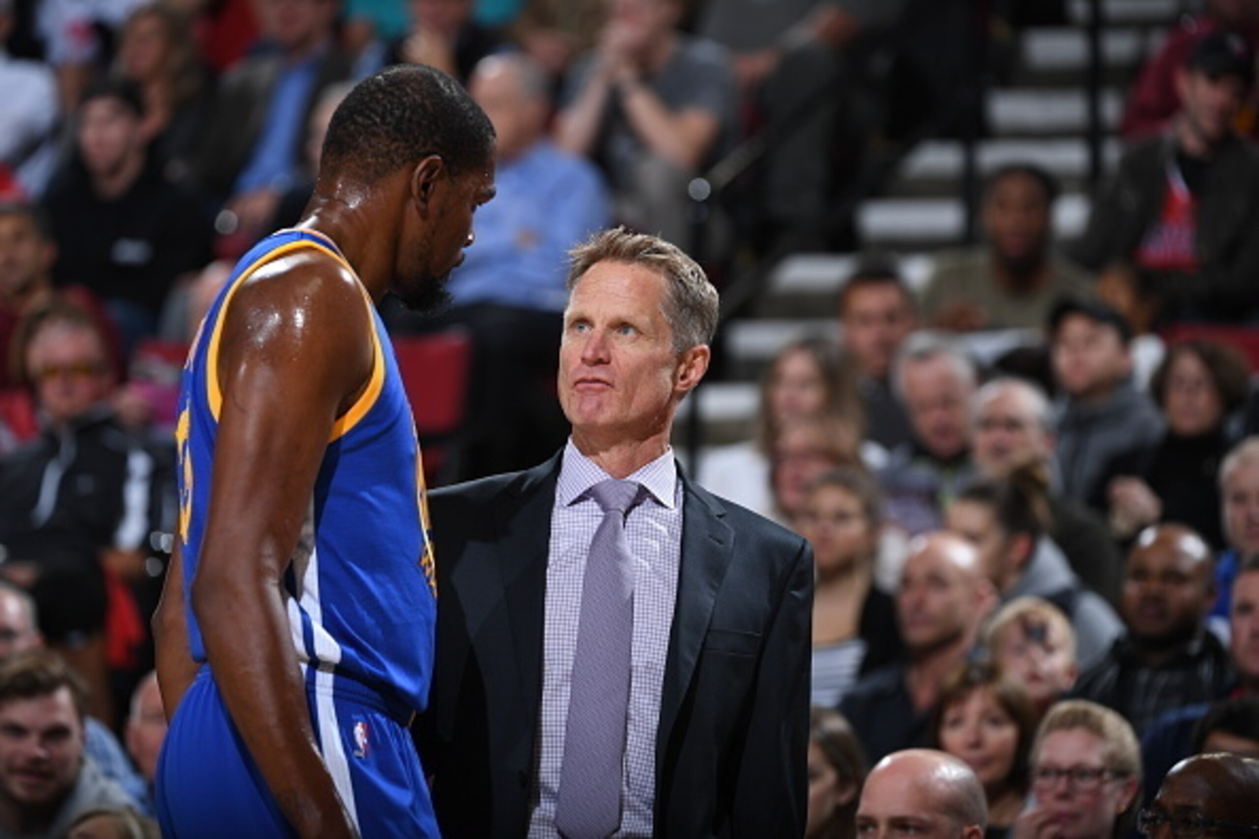PORTLAND, OR - NOVEMBER 1:  Steve Kerr of the Golden State Warriors talks with Kevin Durant #35 during the game against the Portland Trail Blazerson November 1, 2016 at Moda Center in Portland, Oregon. NOTE TO USER: User expressly acknowledges and agrees 