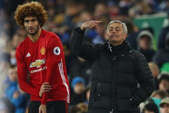 LIVERPOOL, ENGLAND - DECEMBER 04:  Jose Mourinho manager of Manchester United stands alongside his substitute Marouane Fellaini of Manchester United during the Premier League match between Everton and Manchester United at Goodison Park on December 4, 2016