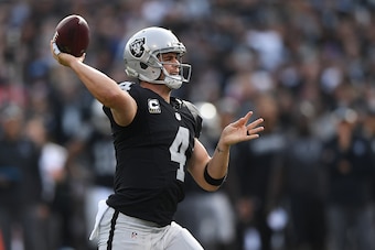 OAKLAND, CA - DECEMBER 04:  Derek Carr #4 of the Oakland Raiders looks to pass against the Buffalo Bills during their NFL game at Oakland Alameda Coliseum on December 4, 2016 in Oakland, California.  (Photo by Thearon W. Henderson/Getty Images)