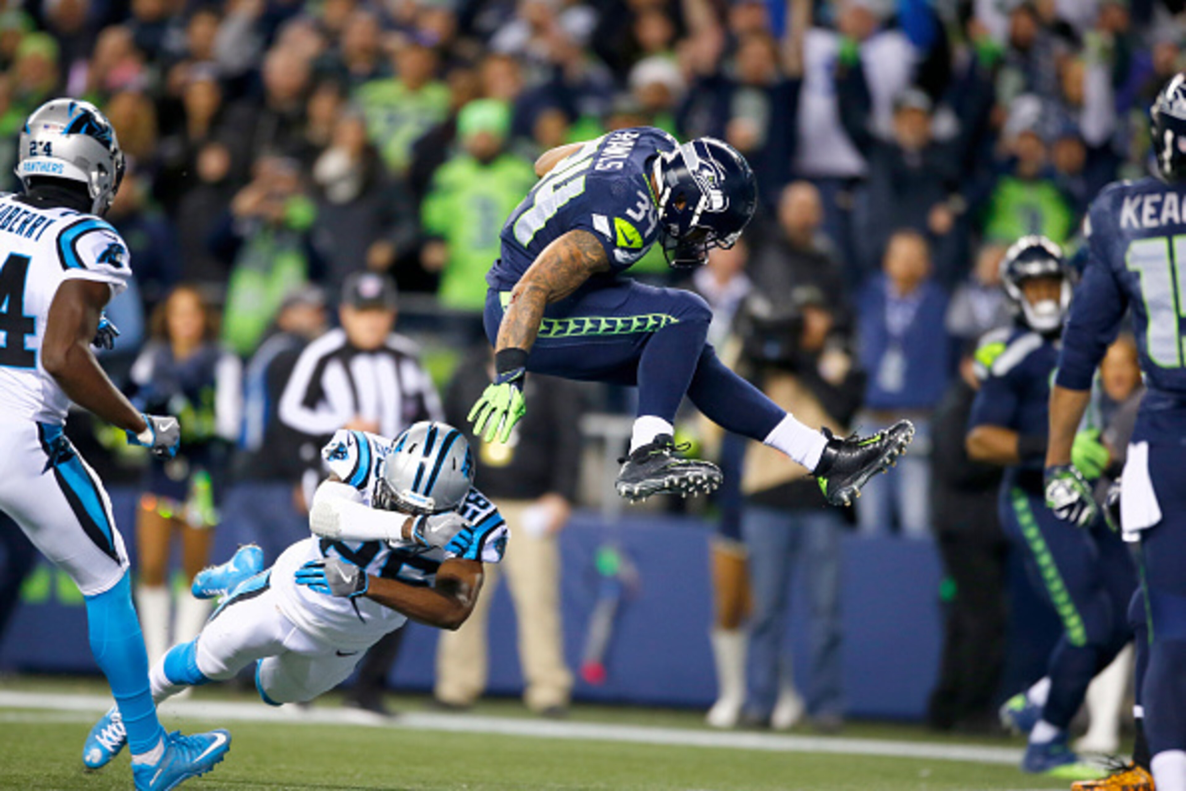 SEATTLE, WA - DECEMBER 04:  Running back Thomas Rawls #34 of the Seattle Seahawks leaps into the endzone for a touchdown against the Carolina Panthers at CenturyLink Field on December 4, 2016 in Seattle, Washington.  (Photo by Otto Greule Jr/Getty Images)