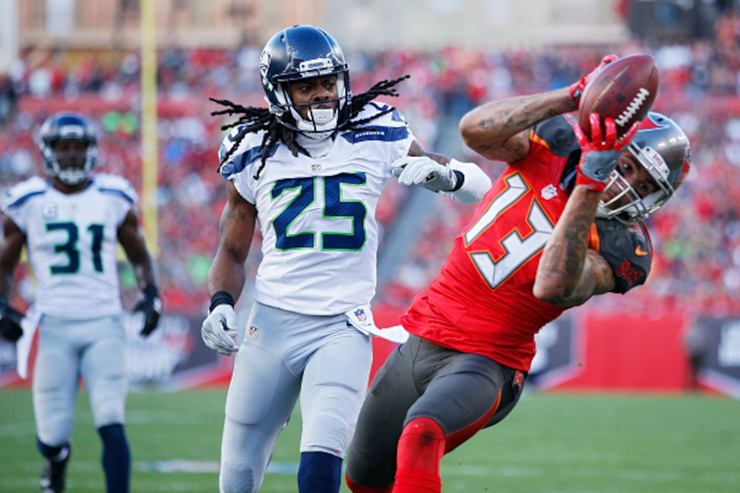 TAMPA, FL - NOVEMBER 27: Richard Sherman #25 of the Seattle Seahawks allows a touchdown reception by Mike Evans #13 of the Tampa Bay Buccaneers during the game at Raymond James Stadium on November 27, 2016 in Tampa, Florida. The Buccaneers defeated the Se TAMPA, FL - NOVEMBER 27: Richard Sherman #25 of the Seattle Seahawks allows a touchdown reception by Mike Evans #13 of the Tampa Bay Buccaneers during the game at Raymond James Stadium on November 27, 2016 in Tampa, Florida. The Buccaneers defeated the Se