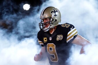NEW ORLEANS, LA - DECEMBER 04:  Drew Brees #9 of the New Orleans Saints runs onto the field during a game against the Detroit Lions at the Mercedes-Benz Superdome on December 4, 2016 in New Orleans, Louisiana.  (Photo by Sean Gardner/Getty Images)