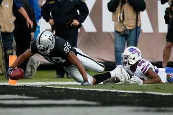 OAKLAND, CA - DECEMBER 04:  Amari Cooper #89 of the Oakland Raiders dives into the end zone for a touchdown against the Buffalo Bills during their NFL game at Oakland Alameda Coliseum on December 4, 2016 in Oakland, California.  (Photo by Brian Bahr/Getty