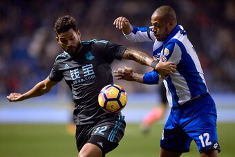 Deportivo La Coruna's Brazilian defender Sidnei (R) vies with Real Sociedad's Brazilian forward Willian Jose during the Spanish league football match RC Deportivo de la Coruna vs Real Sociedad at the Municipal de Riazor stadium in La Coruna on December 5,