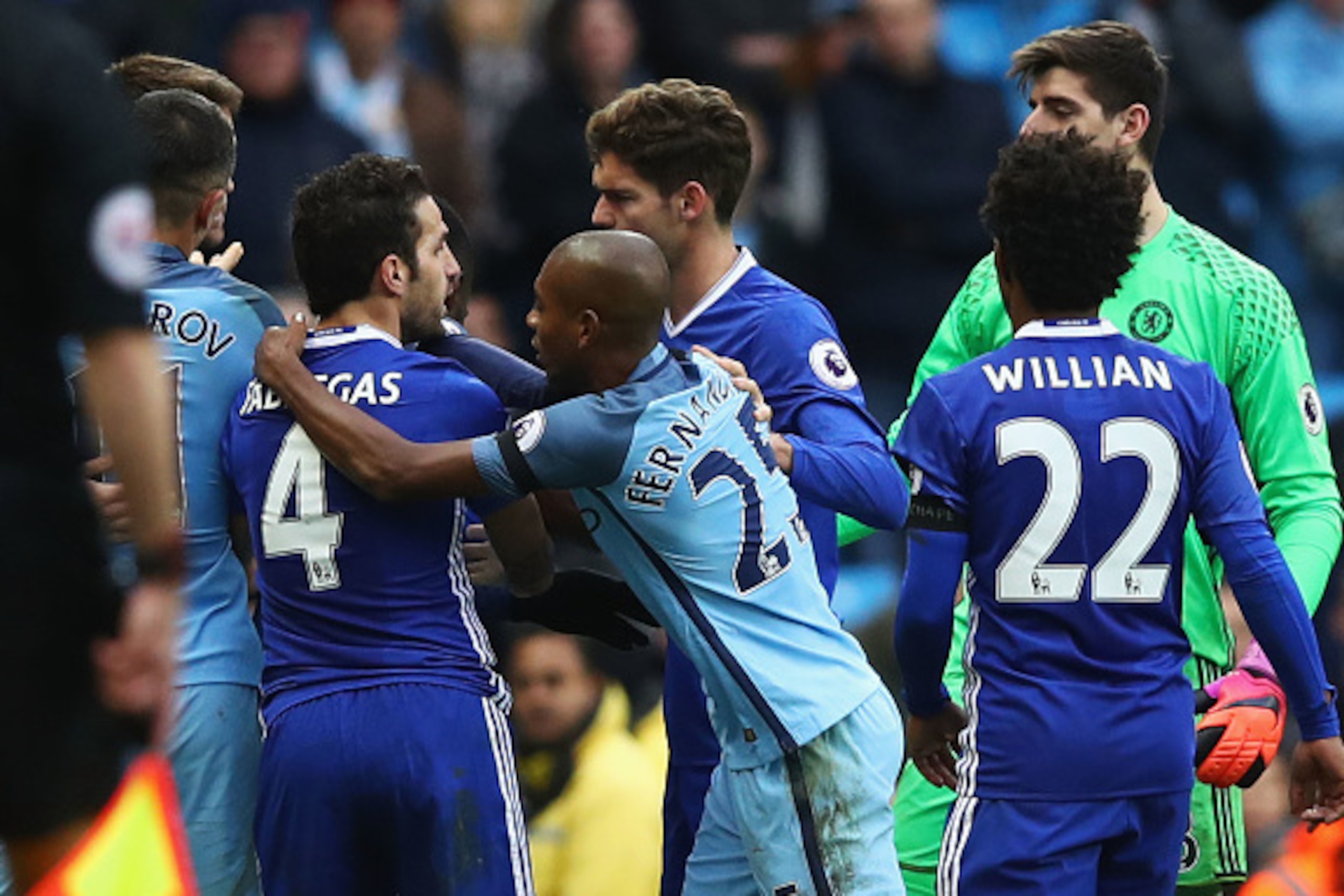 MANCHESTER, ENGLAND - DECEMBER 03:  Cesc Fabregas of Chelsea and Fernandinho of Manchester City clash during the Premier League match between Manchester City and Chelsea at Etihad Stadium on December 3, 2016 in Manchester, England.  (Photo by Clive Brunsk