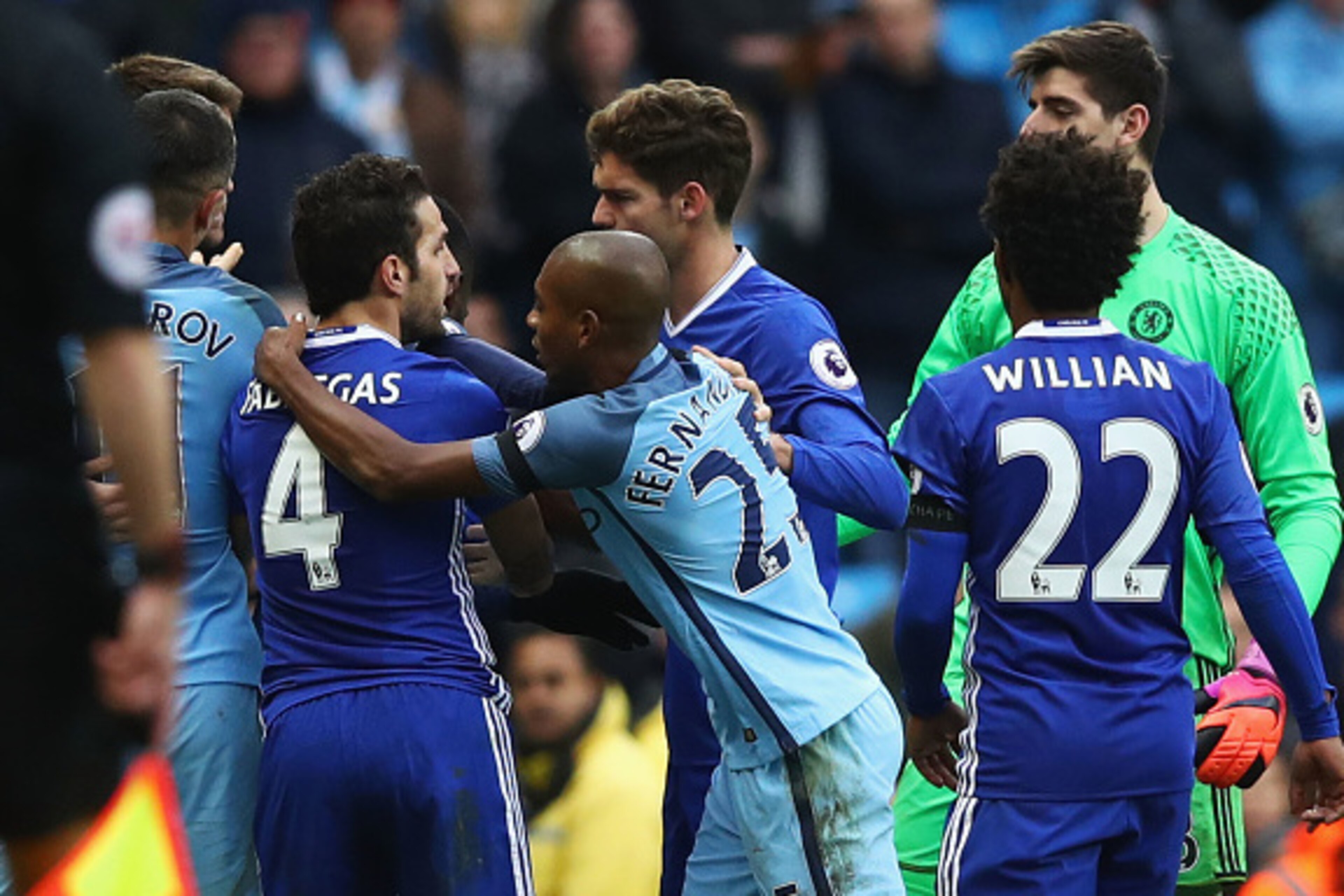 MANCHESTER, ENGLAND - DECEMBER 03:  Cesc Fabregas of Chelsea and Fernandinho of Manchester City clash during the Premier League match between Manchester City and Chelsea at Etihad Stadium on December 3, 2016 in Manchester, England.  (Photo by Clive Brunsk