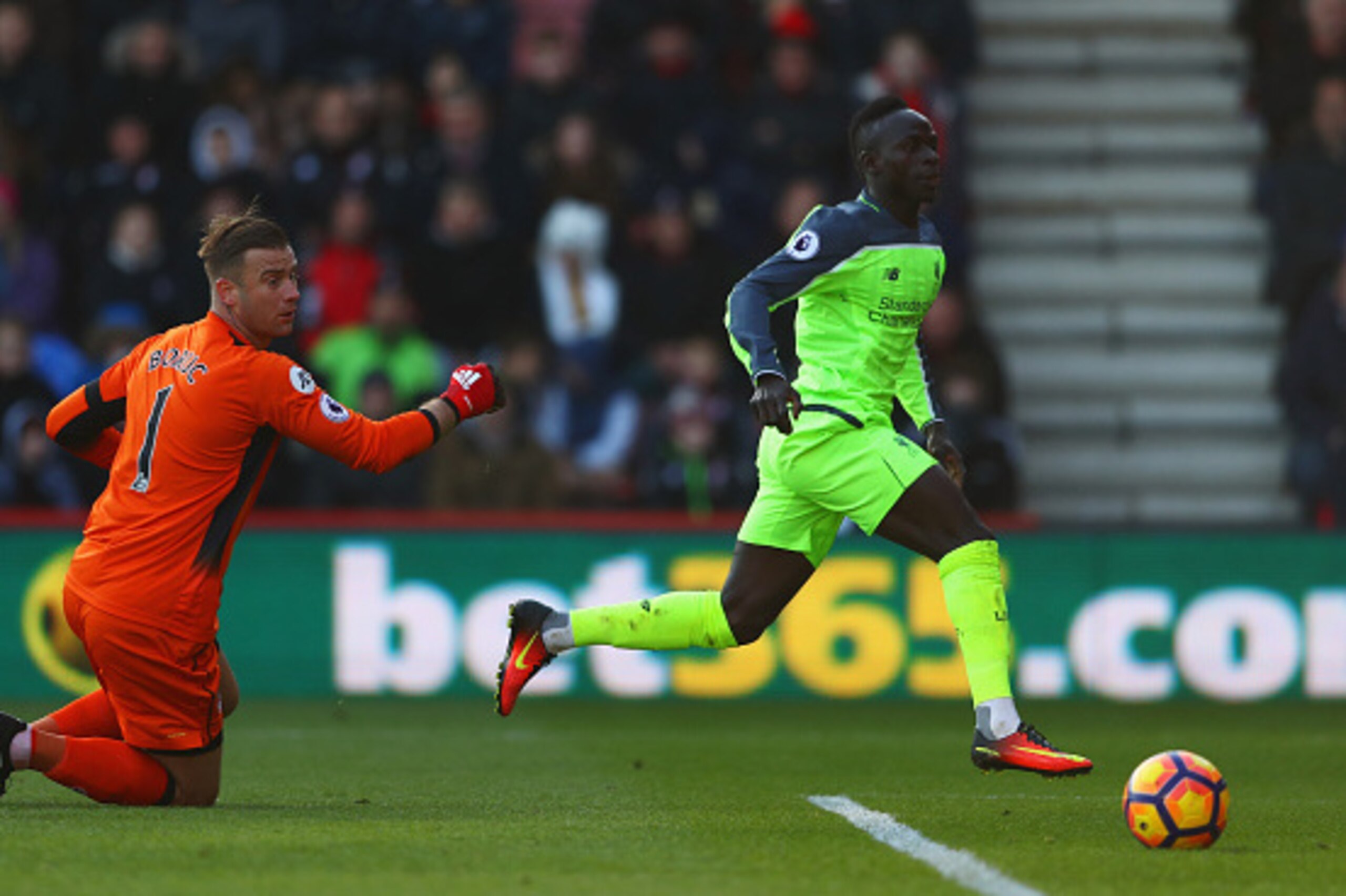 BOURNEMOUTH, ENGLAND - DECEMBER 04:  Sadio Mane of Liverpool beats Artur Boruc of AFC Bournemouth to score their first goal during the Premier League match between AFC Bournemouth and Liverpool at Vitality Stadium on December 4, 2016 in Bournemouth, Engla