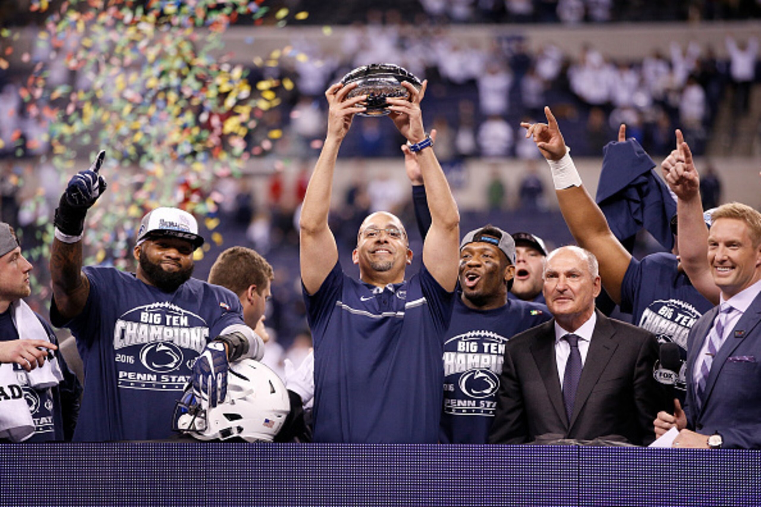 INDIANAPOLIS, IN - DECEMBER 03: James Franklin, head coach of the Penn State Nittany Lions, celebrates with the Big Ten Championship trophy after Penn State beat the Wisconsin Badgers 38-31 at Lucas Oil Stadium on December 3, 2016 in Indianapolis, Indiana