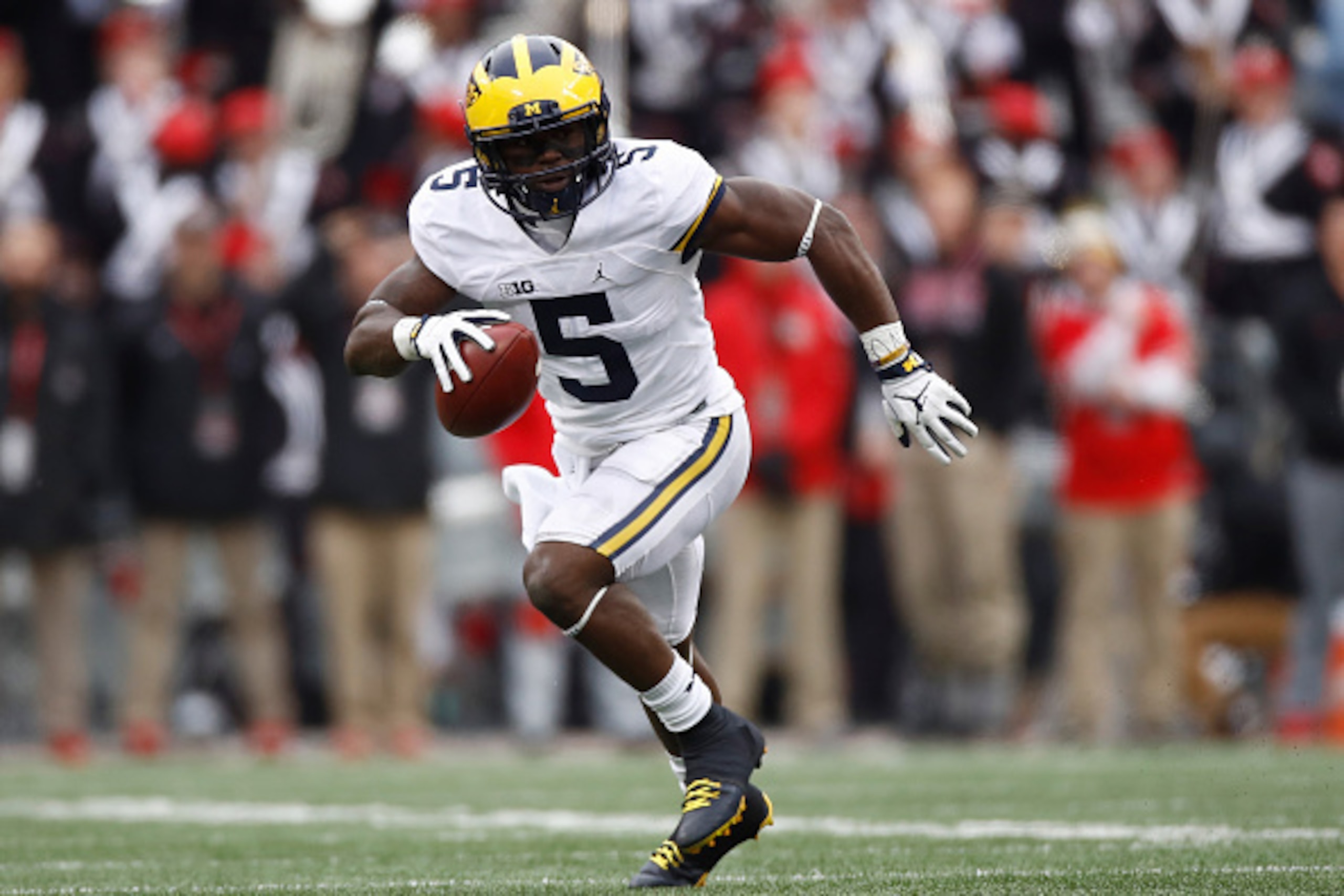 COLUMBUS, OH - NOVEMBER 26:   Jabrill Peppers #5 of the Michigan Wolverines runs after intercepting a pass from J.T. Barrett #16 of the Ohio State Buckeyes during the second half of their game at Ohio Stadium on November 26, 2016 in Columbus, Ohio.  (Phot