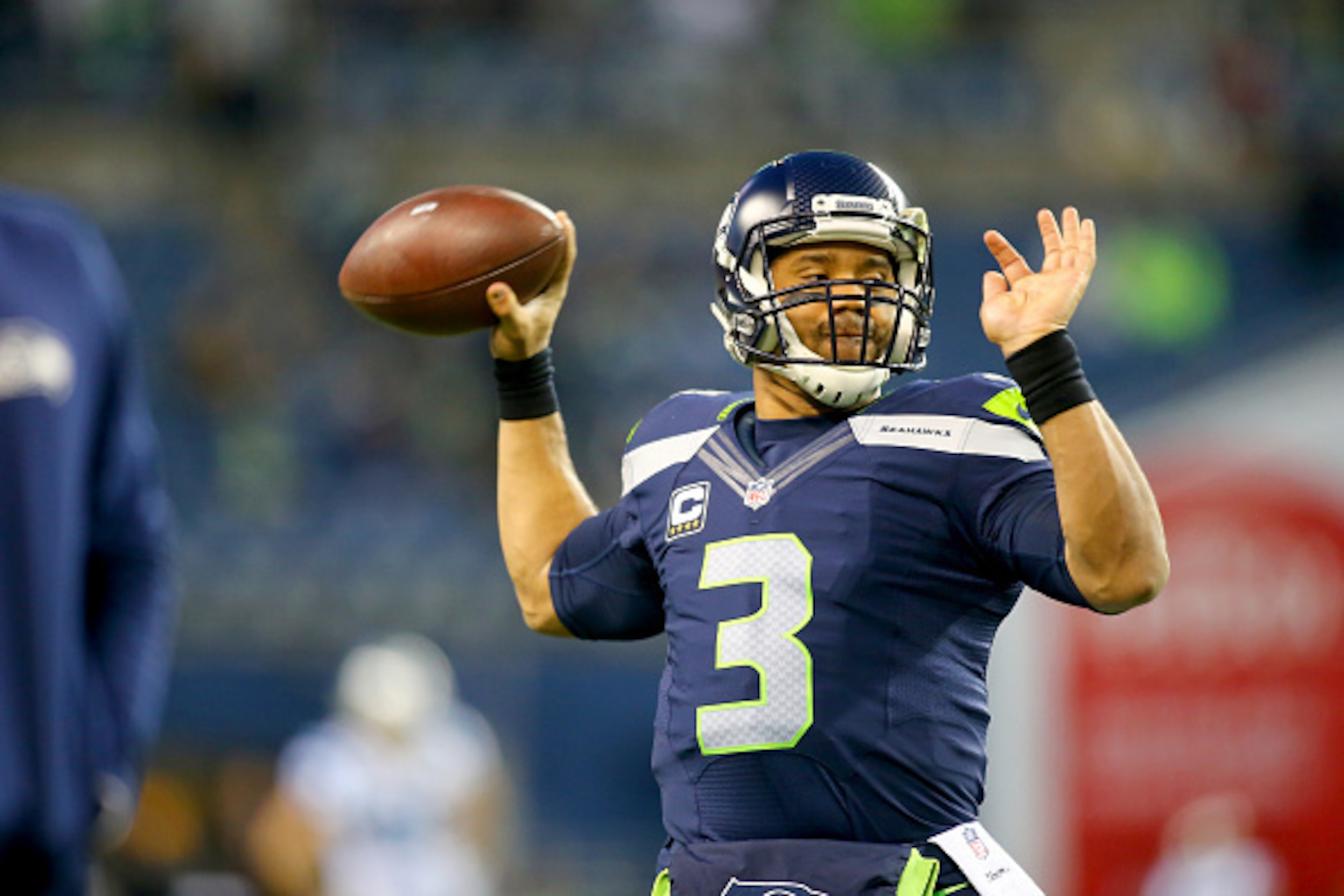 SEATTLE, WA - DECEMBER 04: Quarterback Russell Wilson #3 of the Seattle Seahawks passes during warmups before a game against the Carolina Panthers at CenturyLink Field on December 4, 2016 in Seattle, Washington. (Photo by Jonathan Ferrey/Getty Images) SEATTLE, WA - DECEMBER 04: Quarterback Russell Wilson #3 of the Seattle Seahawks passes during warmups before a game against the Carolina Panthers at CenturyLink Field on December 4, 2016 in Seattle, Washington. (Photo by Jonathan Ferrey/Getty Images)
