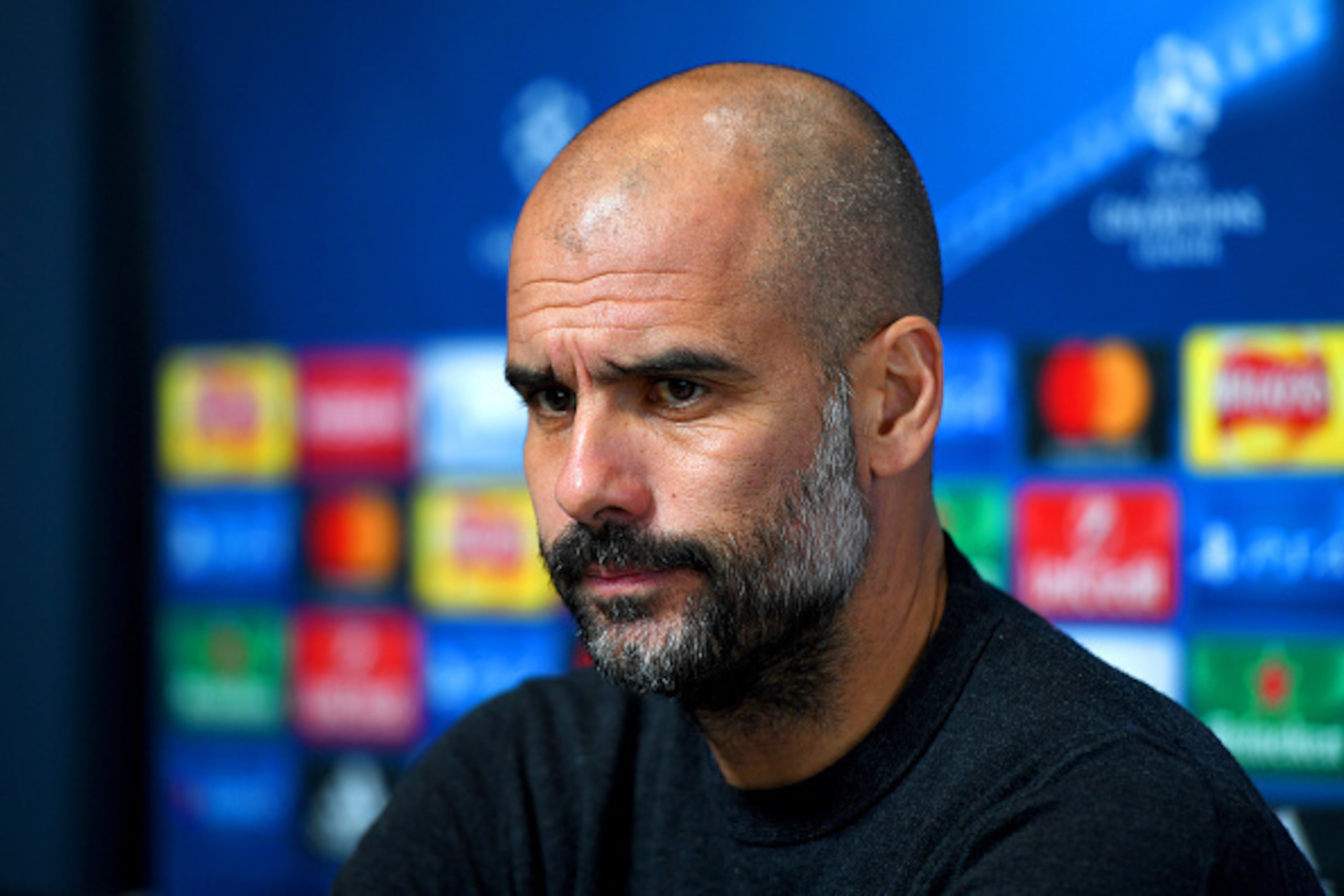MANCHESTER, ENGLAND - DECEMBER 05:  Pep Guardiola, manager of Manchester City looks on during a press conference ahead of the UEFA Champions League group C match against Celtic at the Football Academy Campus on December 5, 2016 in Manchester, England.  (P