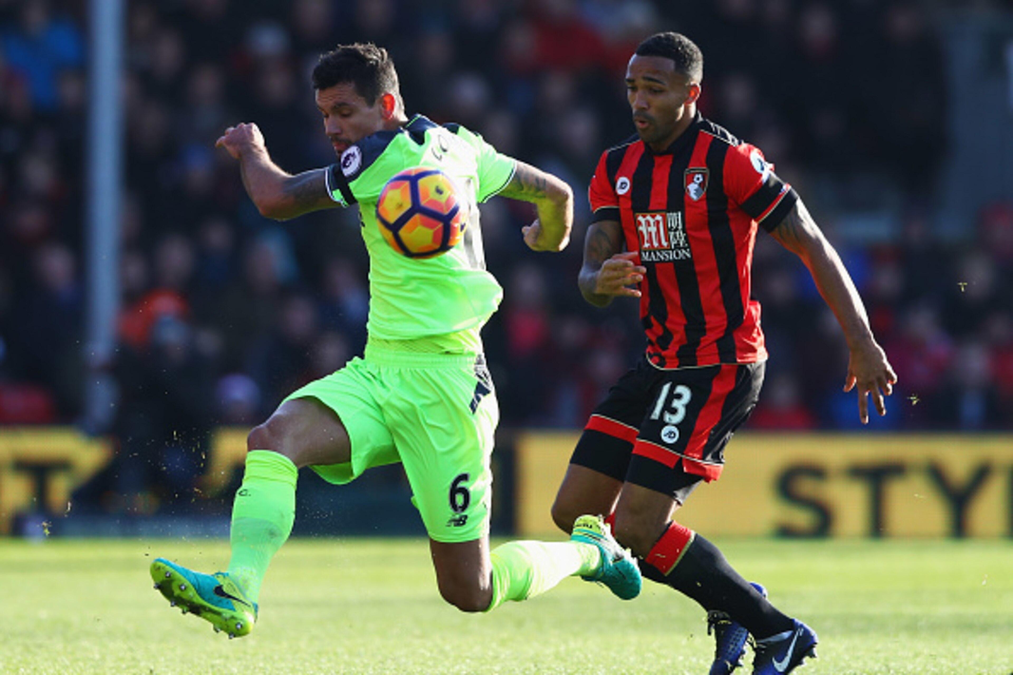 BOURNEMOUTH, ENGLAND - DECEMBER 04:  Dejan Lovren of Liverpool clears from Callum Wilson of AFC Bournemouth during the Premier League match between AFC Bournemouth and Liverpool at Vitality Stadium on December 4, 2016 in Bournemouth, England.  (Photo by M
