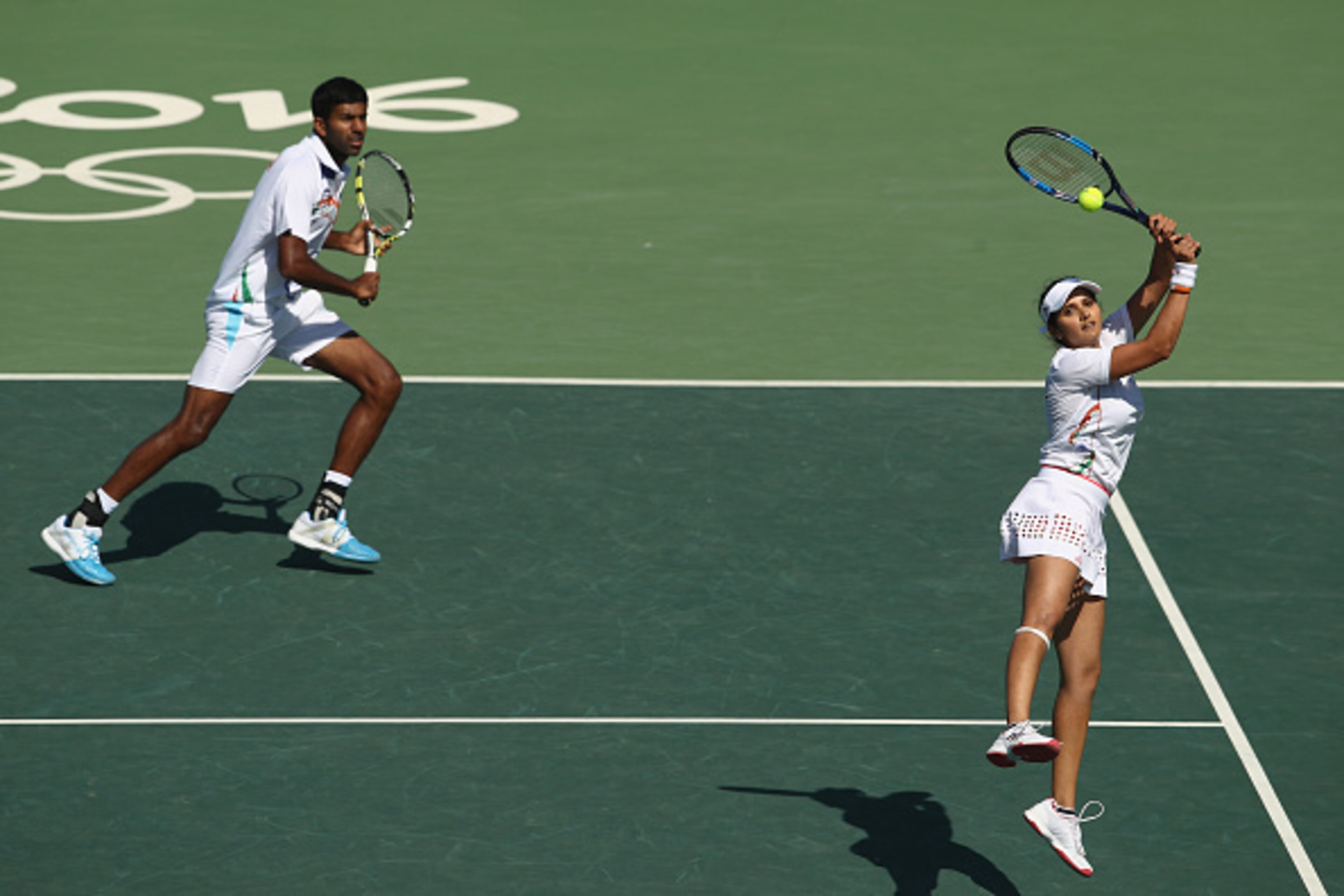RIO DE JANEIRO, BRAZIL - AUGUST 14:  Rohan Bopanna and Sania Mirza of India in action during the mixed doubles bronze medal match against  Radek Stepanek and Lucie Hradecka of the Czech Republic on Day 9 of the Rio 2016 Olympic Games at the Olympic Tennis