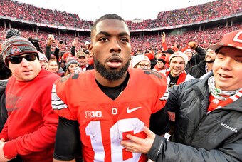 COLUMBUS, OH - NOVEMBER 26:   J.T. Barrett #16 of the Ohio State Buckeyes celebrates after defeating the Michigan Wolverines at Ohio Stadium on November 26, 2016 in Columbus, Ohio.  (Photo by Jamie Sabau/Getty Images)