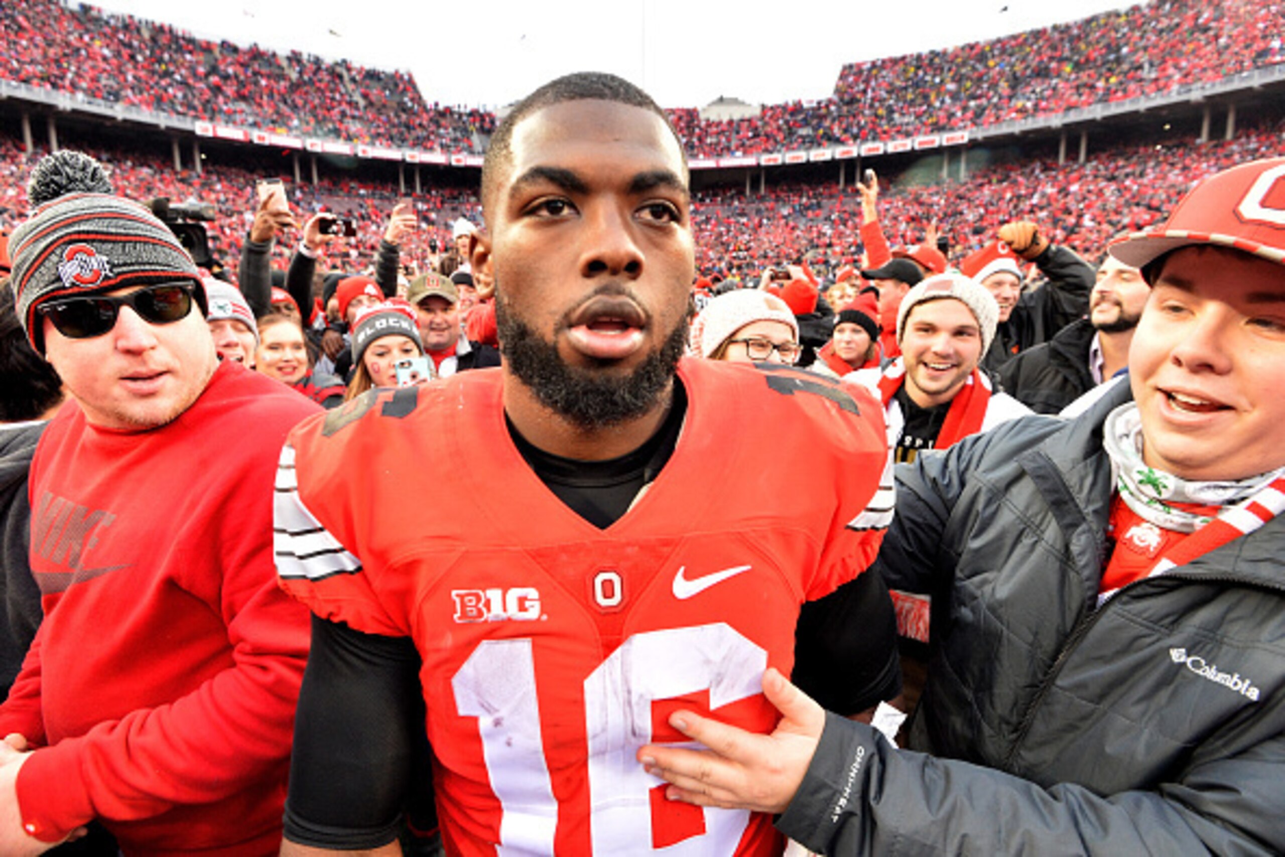 COLUMBUS, OH - NOVEMBER 26:   J.T. Barrett #16 of the Ohio State Buckeyes celebrates after defeating the Michigan Wolverines at Ohio Stadium on November 26, 2016 in Columbus, Ohio.  (Photo by Jamie Sabau/Getty Images)