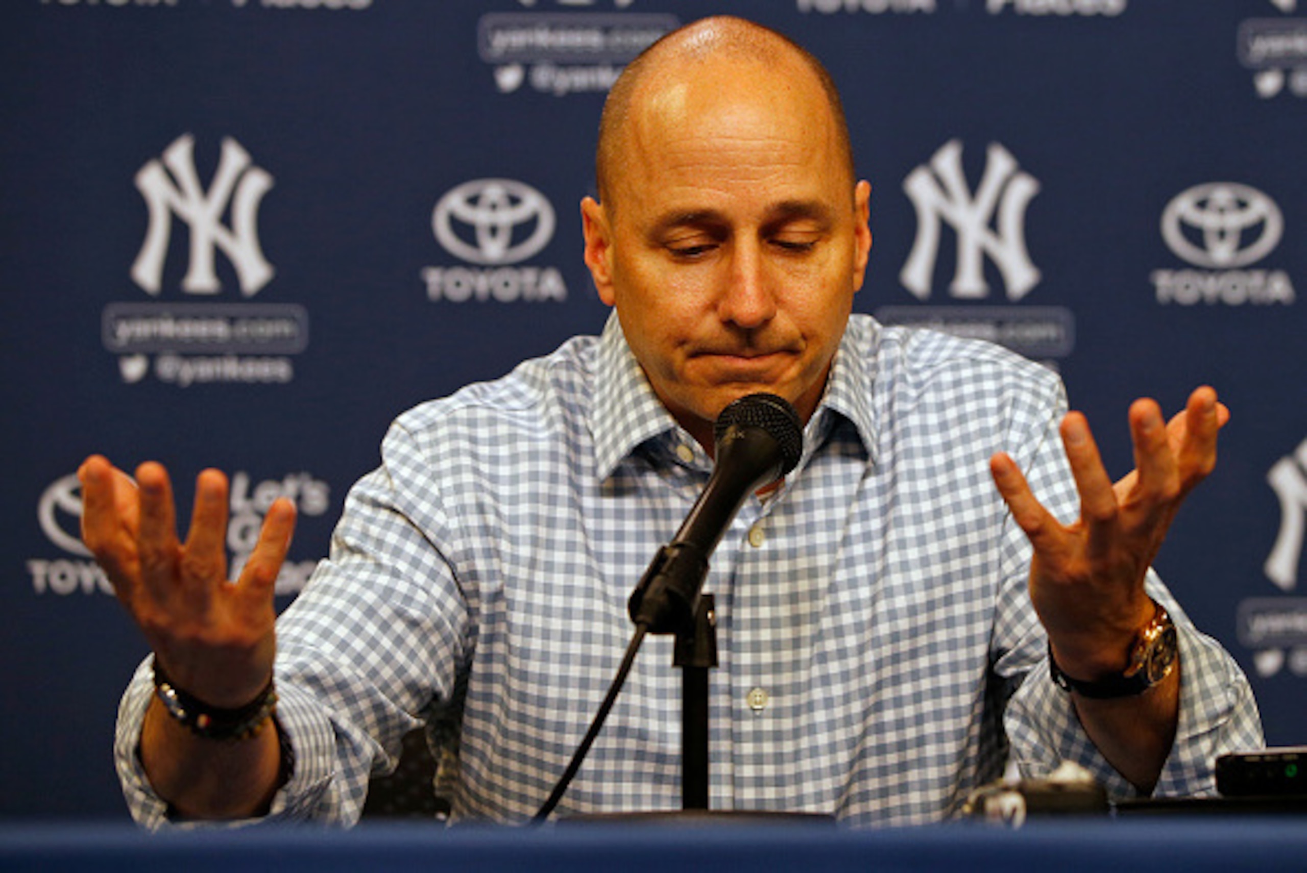 NEW YORK, NY - AUGUST 01: Brian Cashman, general manager of the New York Yankees, talks during a press conference before a game against the New York Mets at Citi Field on August 1, 2016 in the Flushing neighborhood of the Queens borough of New York City. 