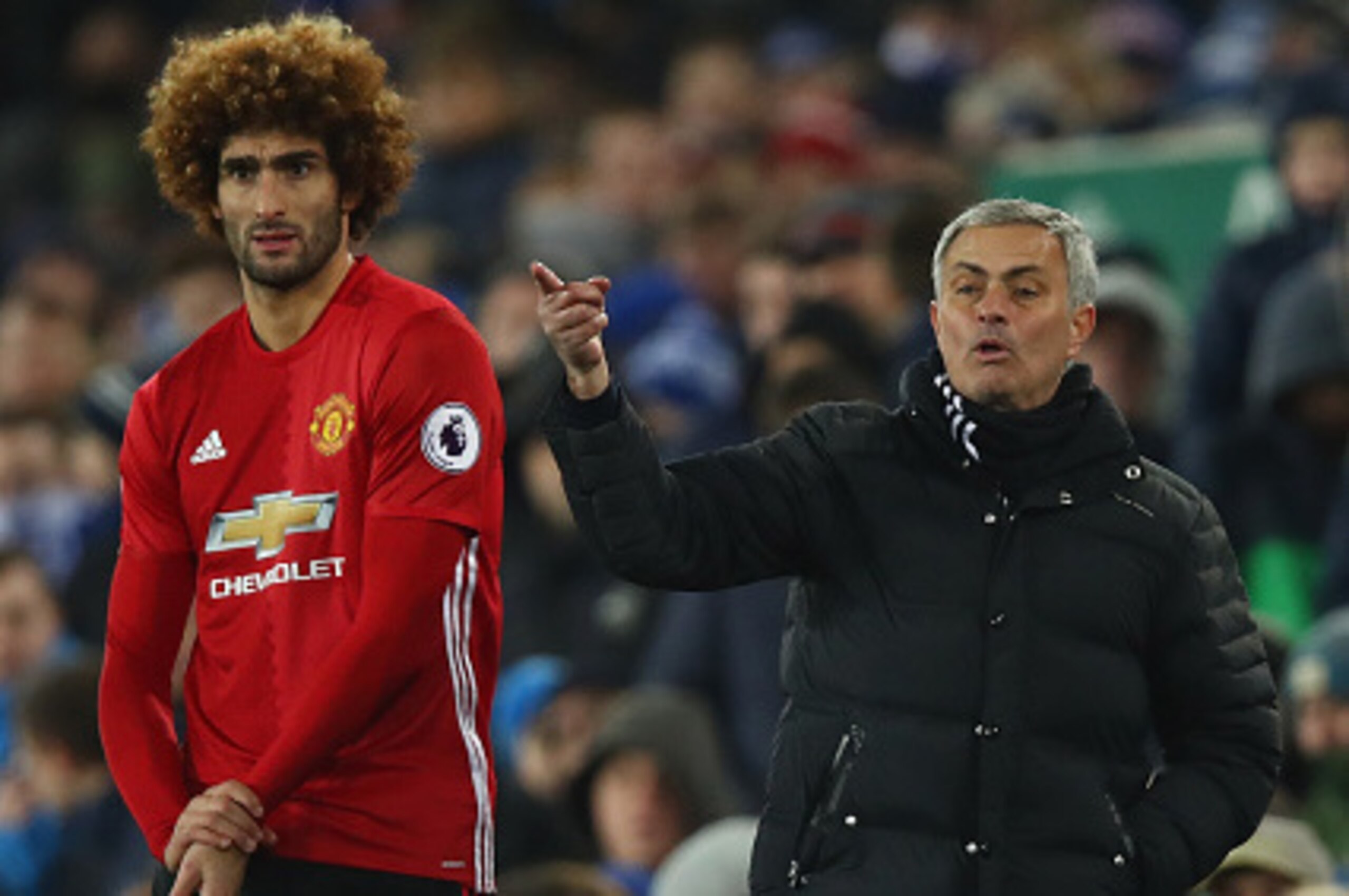 LIVERPOOL, ENGLAND - DECEMBER 04:  Jose Mourinho manager of Manchester United stands alongside his substitute Marouane Fellaini of Manchester United during the Premier League match between Everton and Manchester United at Goodison Park on December 4, 2016