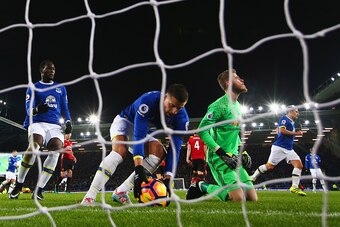LIVERPOOL, ENGLAND - DECEMBER 04:  Kevin Mirallas of Everton collects the ball as David De Gea of Manchester United looks dejected as Leighton Baines of Everton scores their first and equalising goal from the penalty spot during the Premier League match b