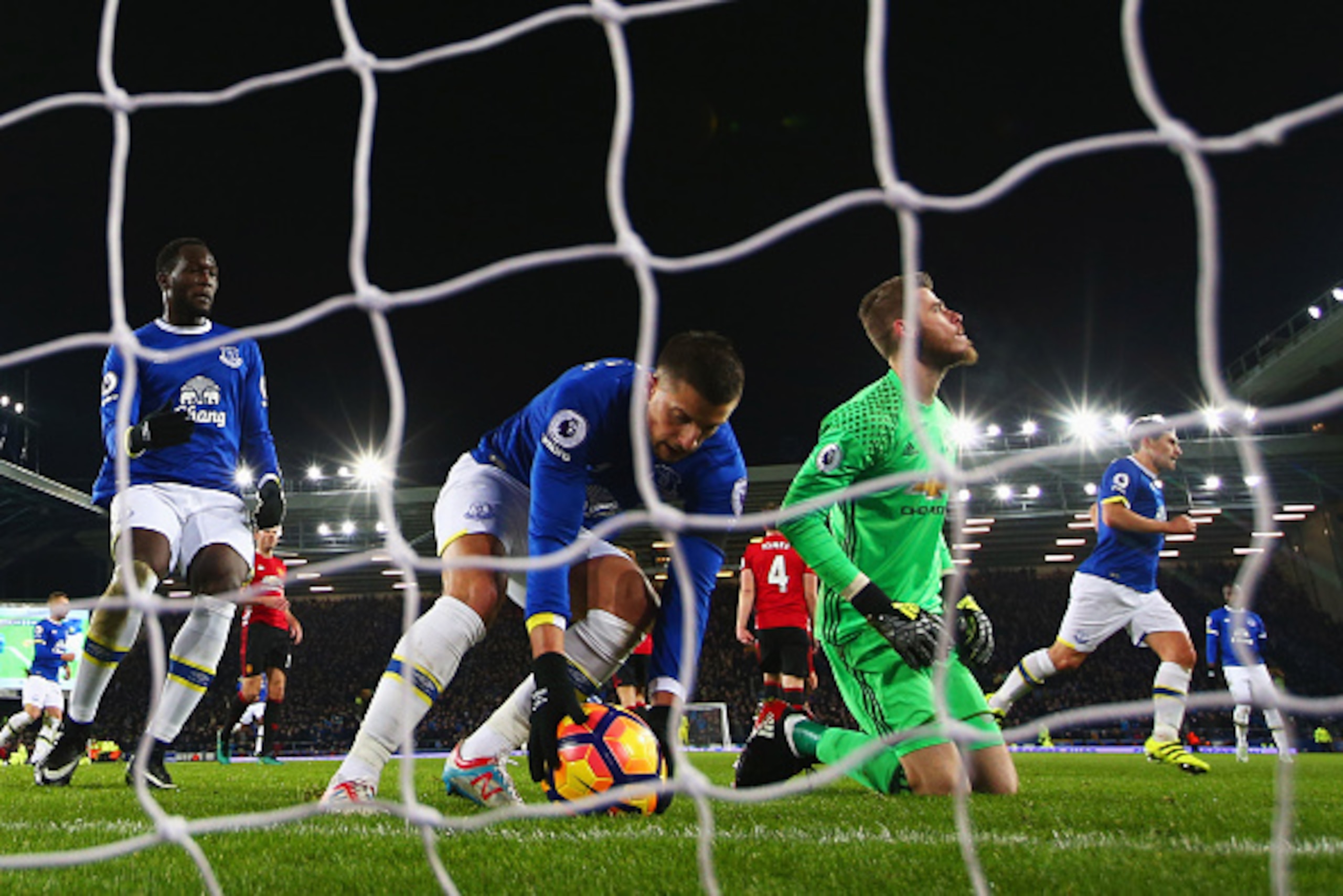LIVERPOOL, ENGLAND - DECEMBER 04:  Kevin Mirallas of Everton collects the ball as David De Gea of Manchester United looks dejected as Leighton Baines of Everton scores their first and equalising goal from the penalty spot during the Premier League match b