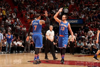 MIAMI, FL - DECEMBER 6:  Carmelo Anthony #7 and Joakim Noah #13 of the New York Knicks high five during the game against the Miami Heat on December 6, 2016 at American Airlines Arena in Miami, Florida. NOTE TO USER: User expressly acknowledges and agrees 