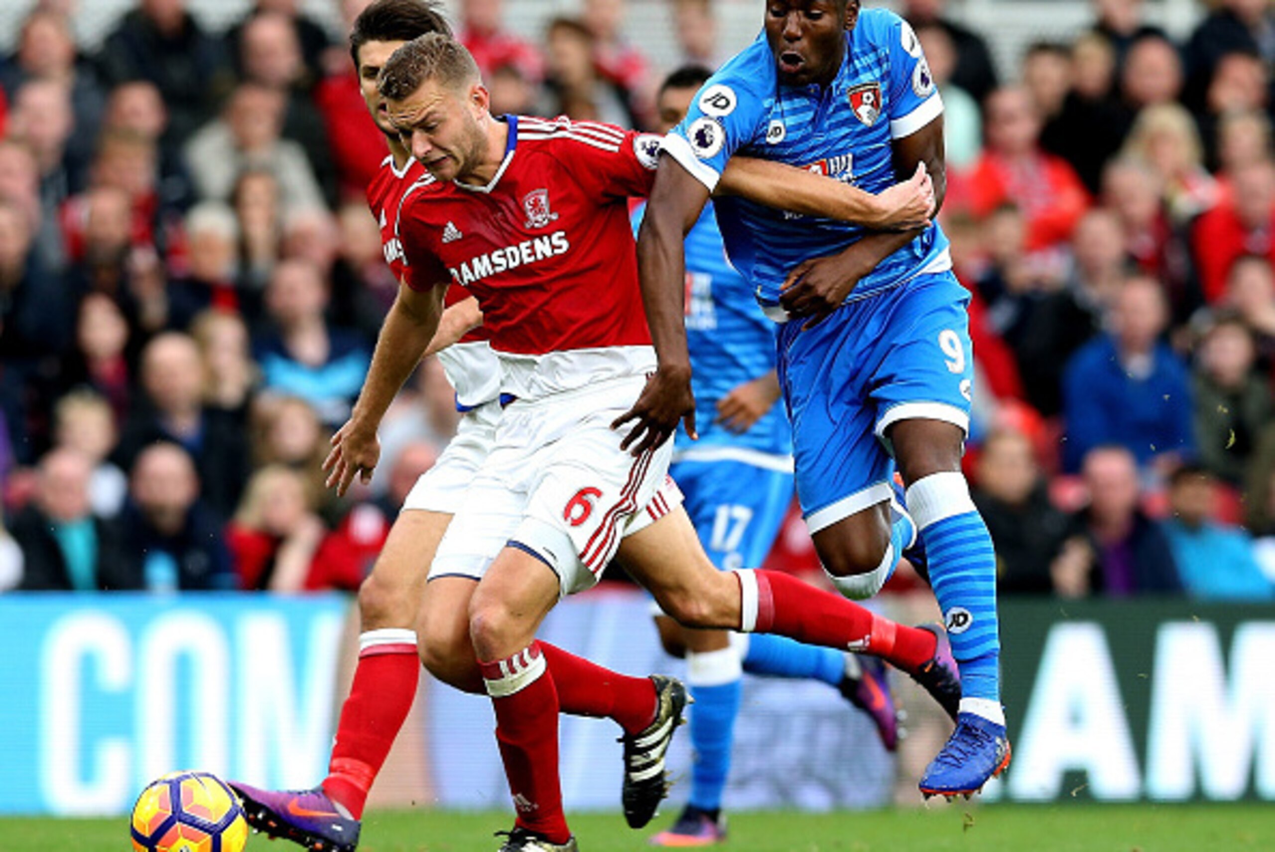 MIDDLESBROUGH, ENGLAND - OCTOBER 29: Benik Afobe of AFC Bournemouth and Ben Gibson of Middlesbrough compete for the ball during the Premier League match between Middlesbrough and AFC Bournemouth at the Riverside Stadium on October 29, 2016 in Middlesbrou MIDDLESBROUGH, ENGLAND - OCTOBER 29: Benik Afobe of AFC Bournemouth and Ben Gibson of Middlesbrough compete for the ball during the Premier League match between Middlesbrough and AFC Bournemouth at the Riverside Stadium on October 29, 2016 in Middlesbrou