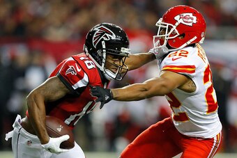 ATLANTA, GA - DECEMBER 04:  Taylor Gabriel #18 of the Atlanta Falcons stiff arms Marcus Peters #22 of the Kansas City Chiefs at Georgia Dome on December 4, 2016 in Atlanta, Georgia.  (Photo by Kevin C. Cox/Getty Images)