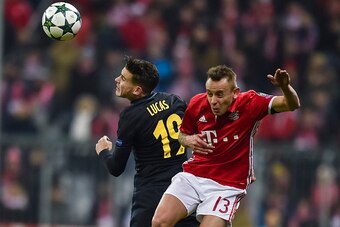Atletico Madrid's French defender Lucas Hernandez and Bayern Munich's Brazilian defender Rafinha vie for the ball during the UEFA Champions League group D football match between FC Bayern Munich and Atletico Madrid in Munich, southern Germany, on December