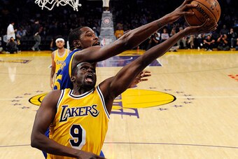LOS ANGELES, CA - NOVEMBER 4: Kevin Durant #35 of the Golden State Warriors blocks a layup by Luol Deng #9 of the Los Angeles Lakers during the first half of the basketball game at Staples Center November 4, 2016, in Los Angeles, California. NOTE TO USER: