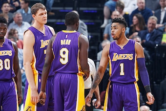 INDIANAPOLIS, IN - NOVEMBER 01: D'Angelo Russell #1 of the Los Angeles Lakers talks to teammates Timofey Mozgov #20 and Luol Deng #9 during the game against the Indiana Pacers at Bankers Life Fieldhouse on November 1, 2016 in Indianapolis, Indiana. The Pa