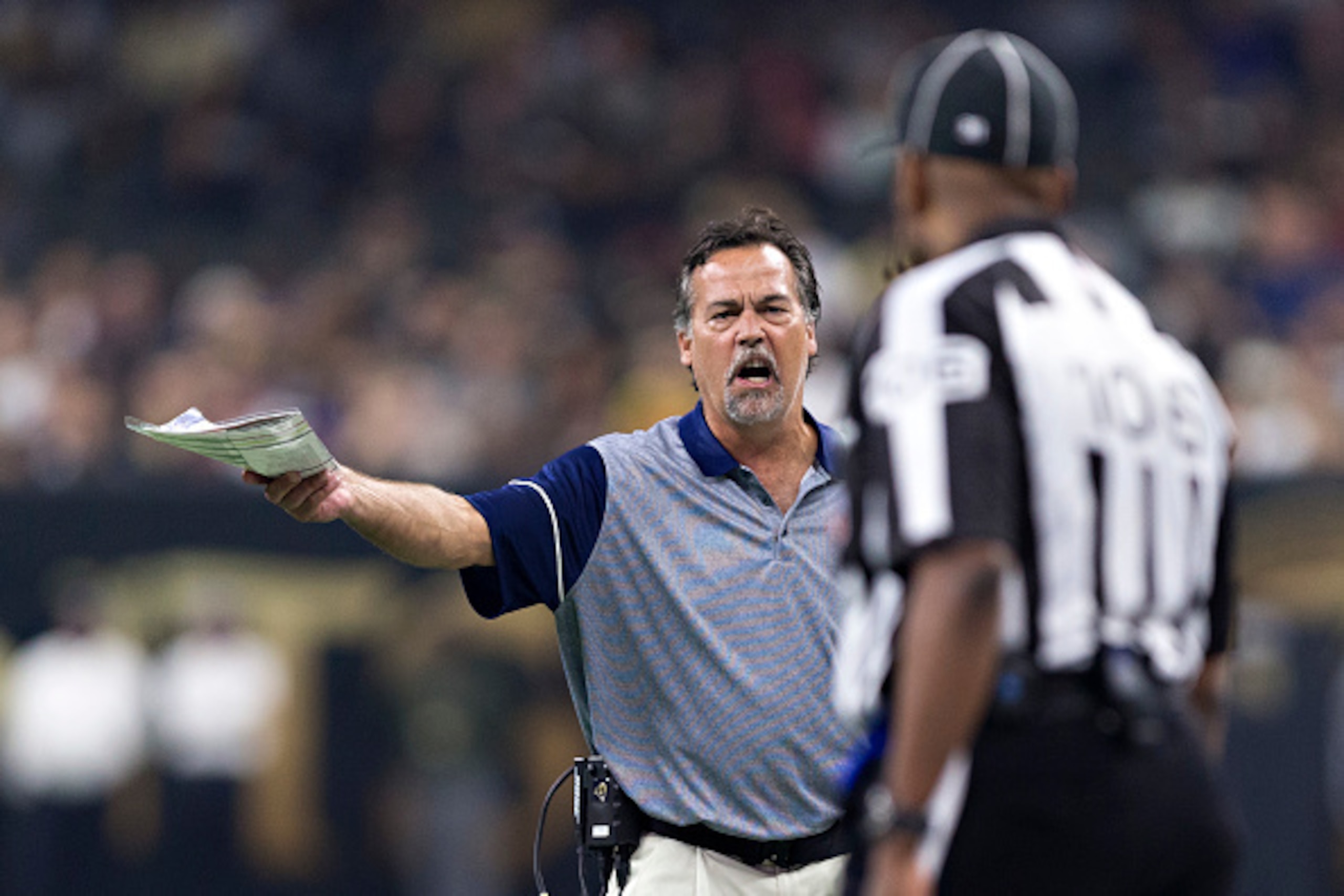 NEW ORLEANS, LA - NOVEMBER 27:  Head Coach Jeff Fisher of the Los Angeles Rams talks with a official during a game against the New Orleans Saints at Mercedes-Benz Superdome on November 27, 2016 in New Orleans, Louisiana.  The Saints defeated the Rams 49-2