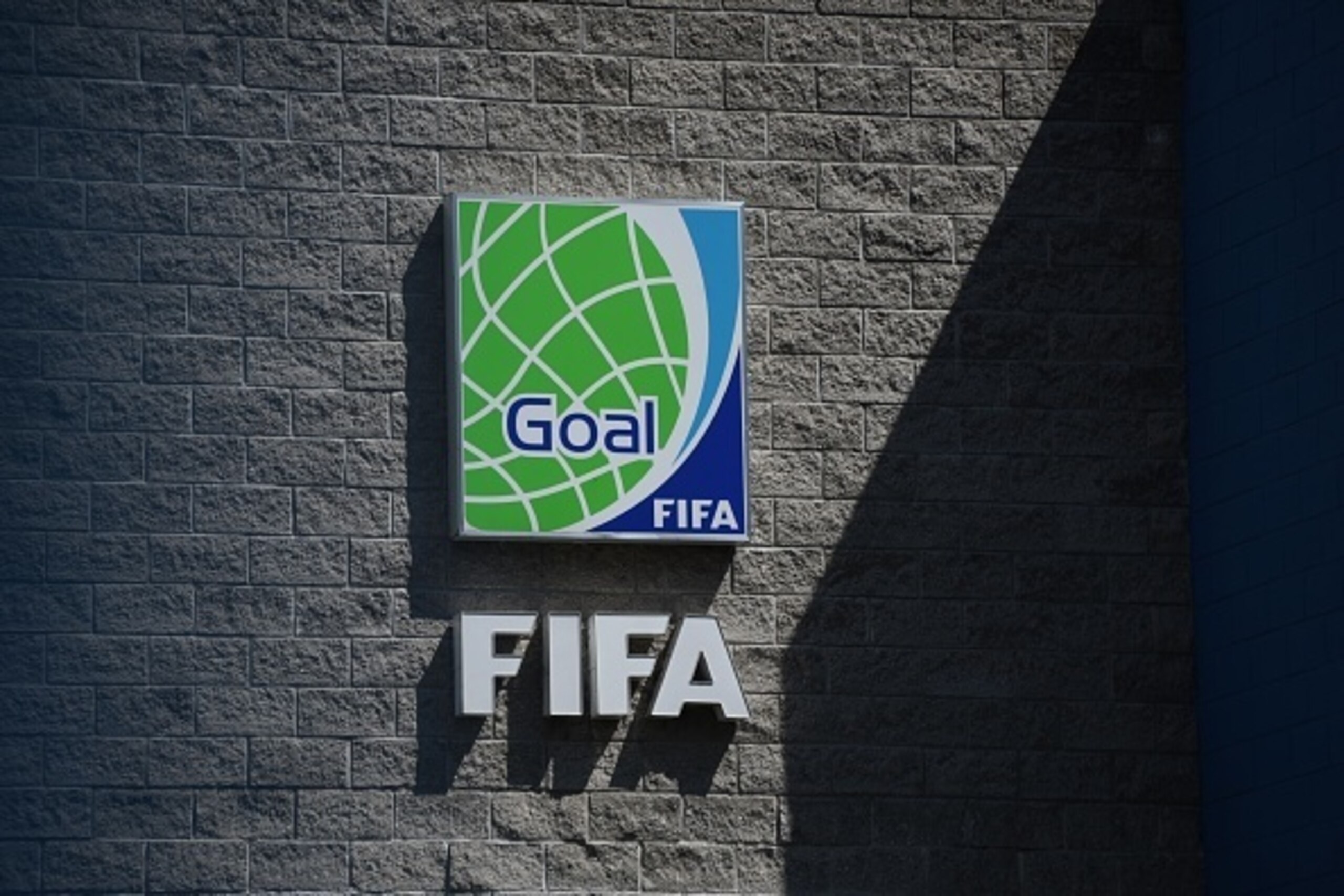 View of a FIFA logo at the main entrance of the Football Federation of Guatemala (FEDEFUT) headquarters in Guatemala city on October 28, 2016. 
FIFA announced Friday the suspension with immediate effect of the National Football Federation of Guatemala (FE